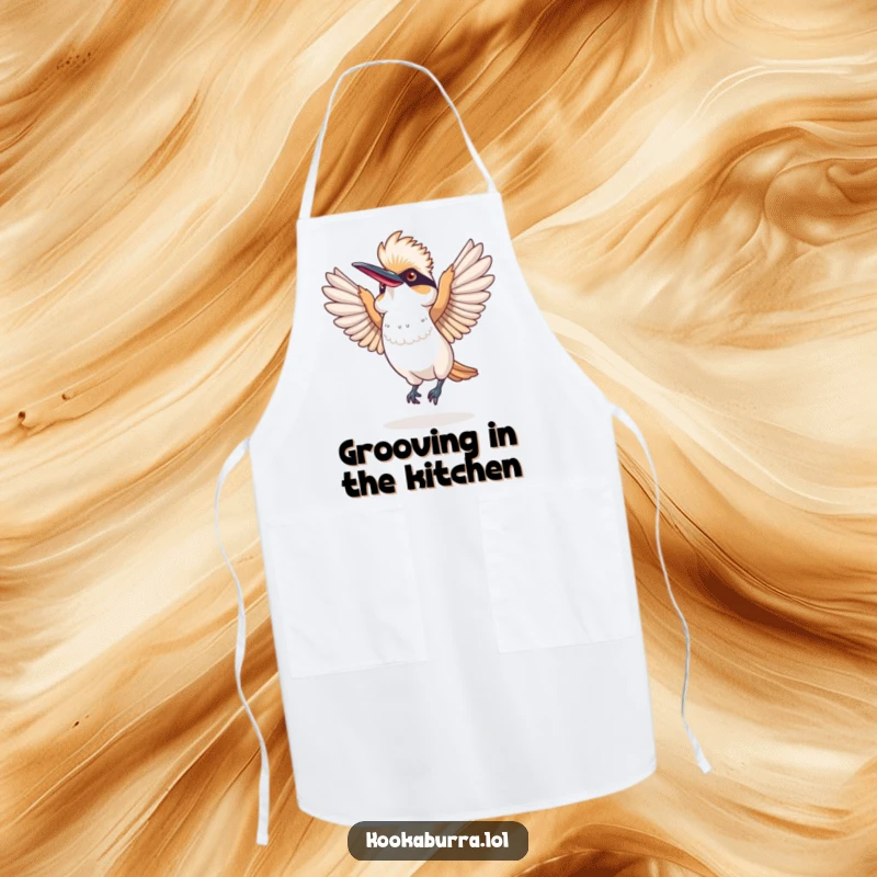Funny apron with a kookaburra performing a silly dance, wings spread wide, designed for kitchen fun and protection.