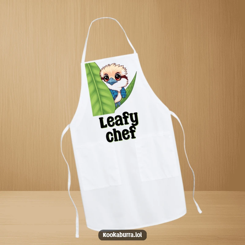 Funny kookaburra apron with a bird having big eyes, peeking from behind a leaf, great for cooks.