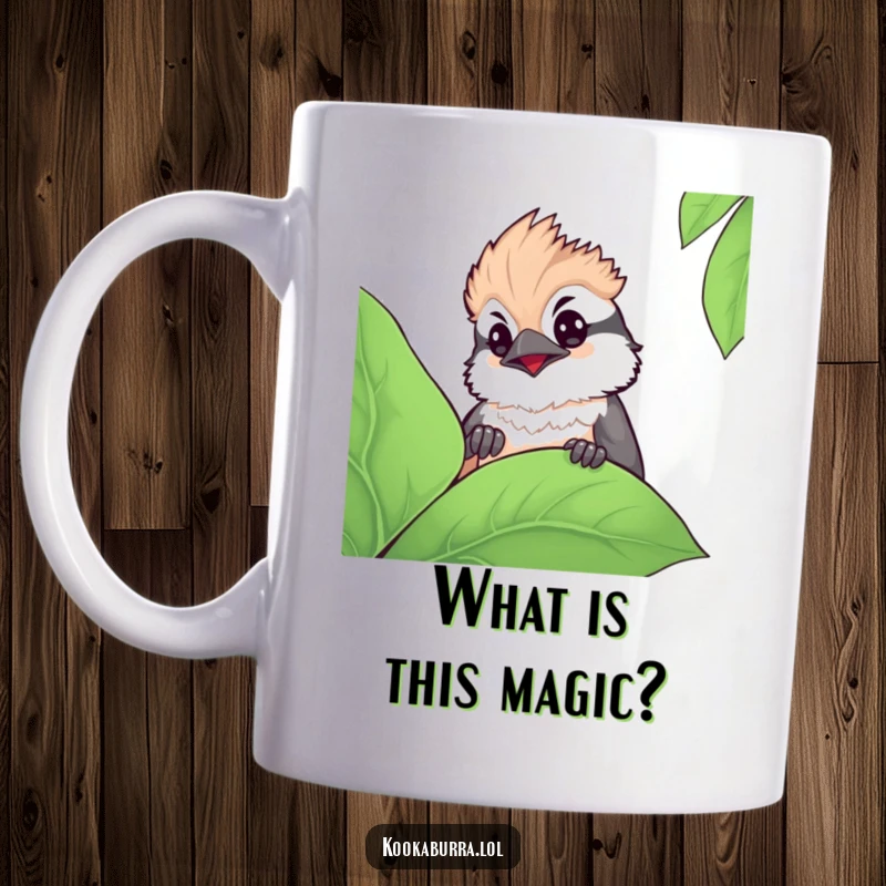 Funny kawaii kookaburra mug showing a cute bird peeking curiously from behind a large green leaf, exuding charm and innocence.