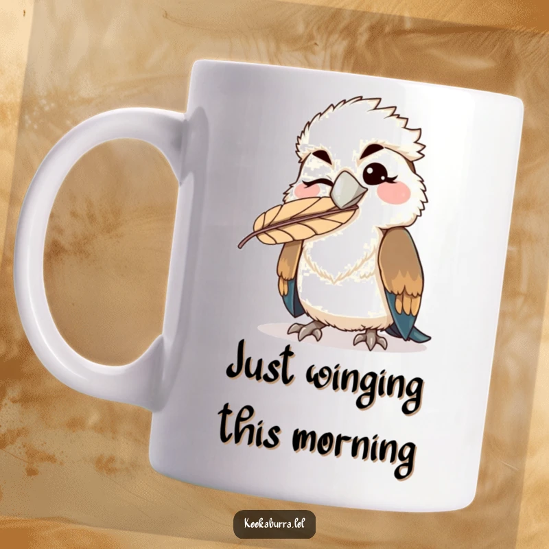 Funny kawaii kookaburra mug winking with a feather humorously stuck on its beak, a playful and comical bird design.