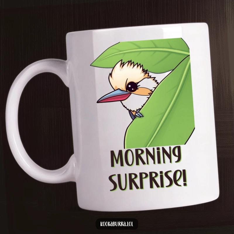 Funny mug featuring a kookaburra peeking from behind a large leaf, giving a mischievous wink to the viewer.