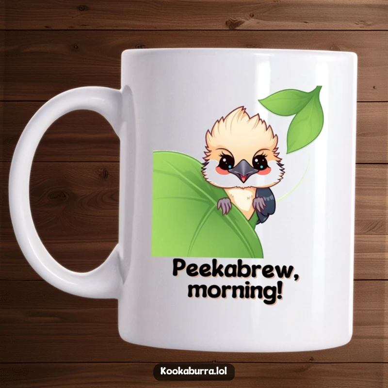 Funny Kawaii Kookaburra mug, cute bird peeking from behind a large leaf, conveying playful mischief. Ideal for bird fans and funny gift seekers.