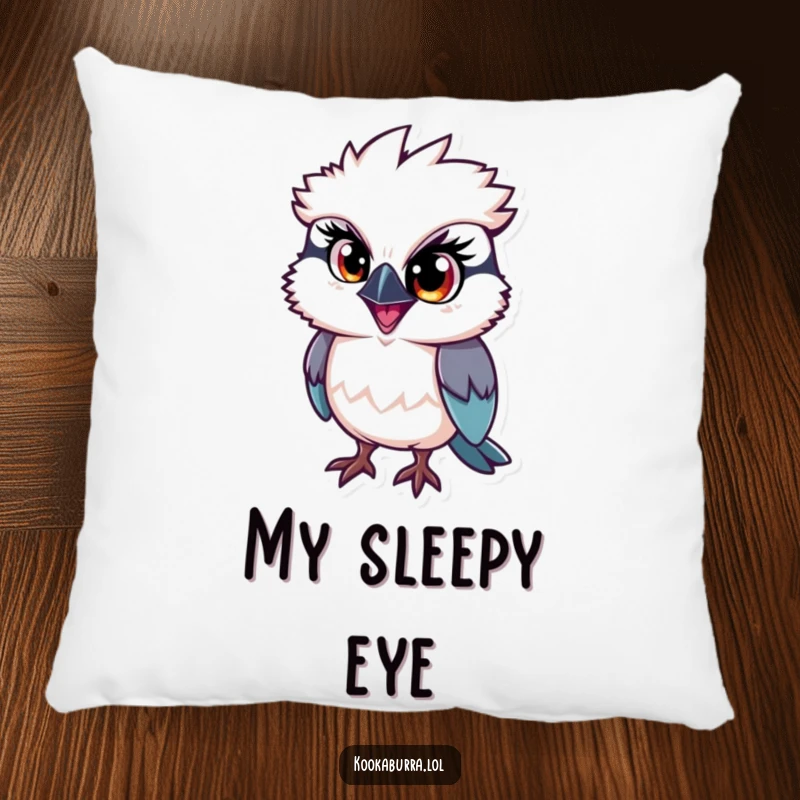 Funny kookaburra pillow, a bird with one large eye sparkling with mischief, adding cozy humor and playful charm.