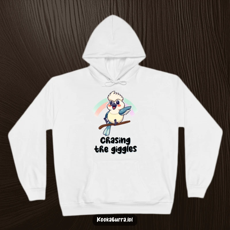 Funny hoodie showing a kookaburra sliding down a rainbow with a cheerful grin, perfect for cozy, happy moments.