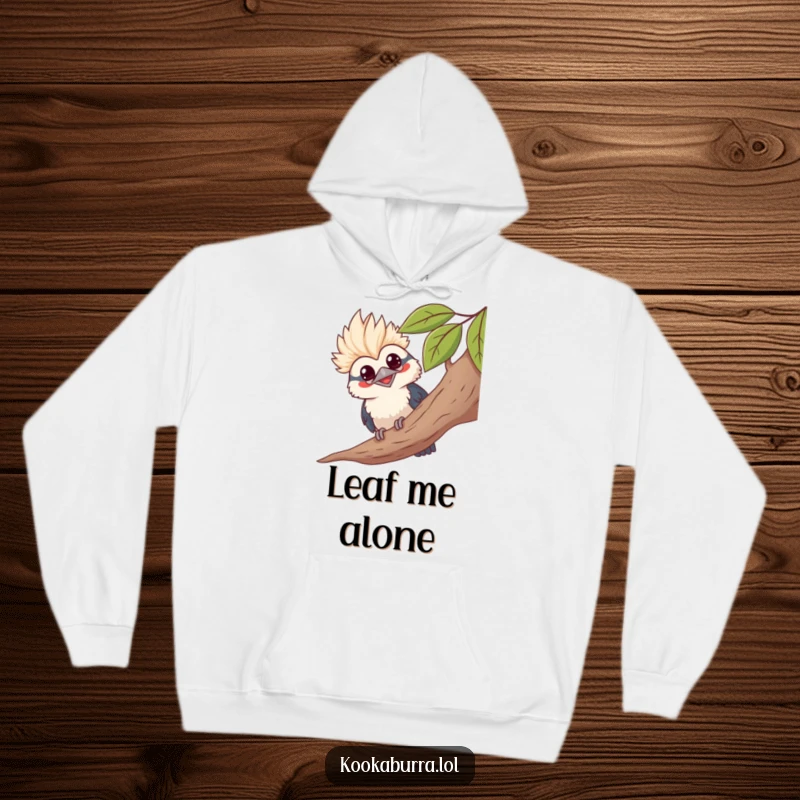 Funny kawaii kookaburra hoodie, peeking from leaves, grinning, cute bird illustration, cozy and humorous apparel.