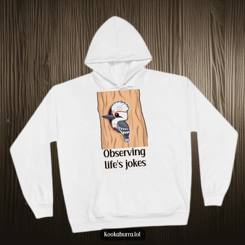 Funny kookaburra hoodie, a mischievous bird peeking from a tree, offering cozy humor and playful charm.