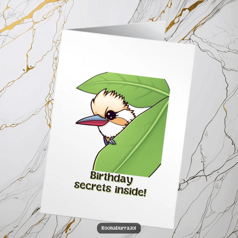 Funny Free Printable Birthday Card featuring a kookaburra peeking from behind a leaf with a mischievous wink. Perfect cheeky downloadable gift.