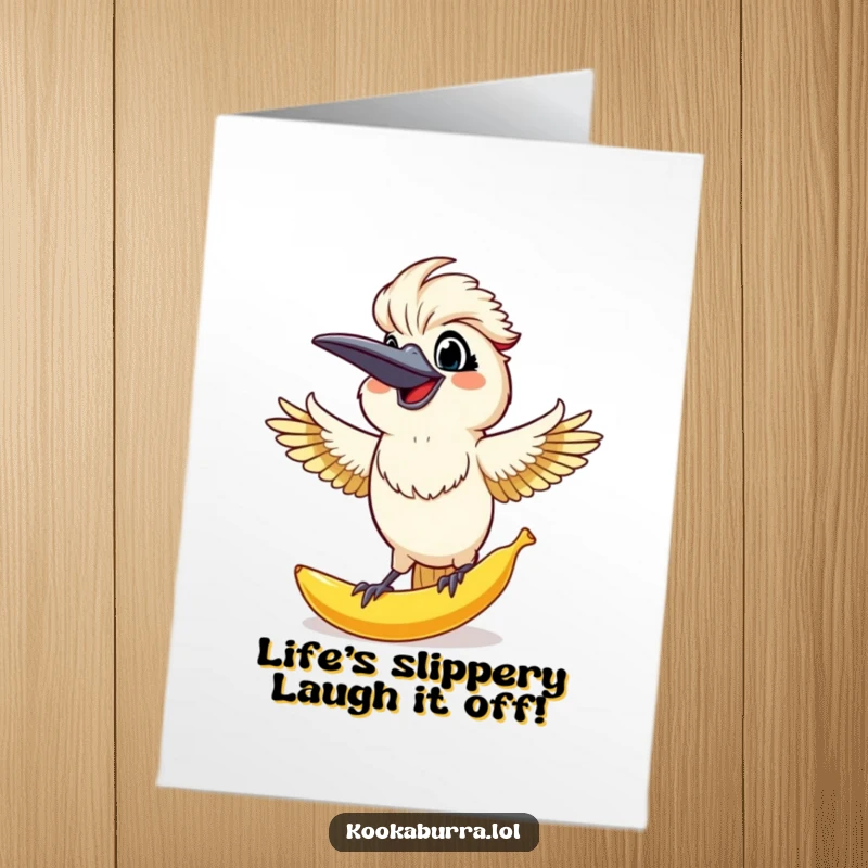 Funny Free Printable Birthday Card: Kookaburra with arms out, surprised grin, catching an oversized banana peel falling from above.