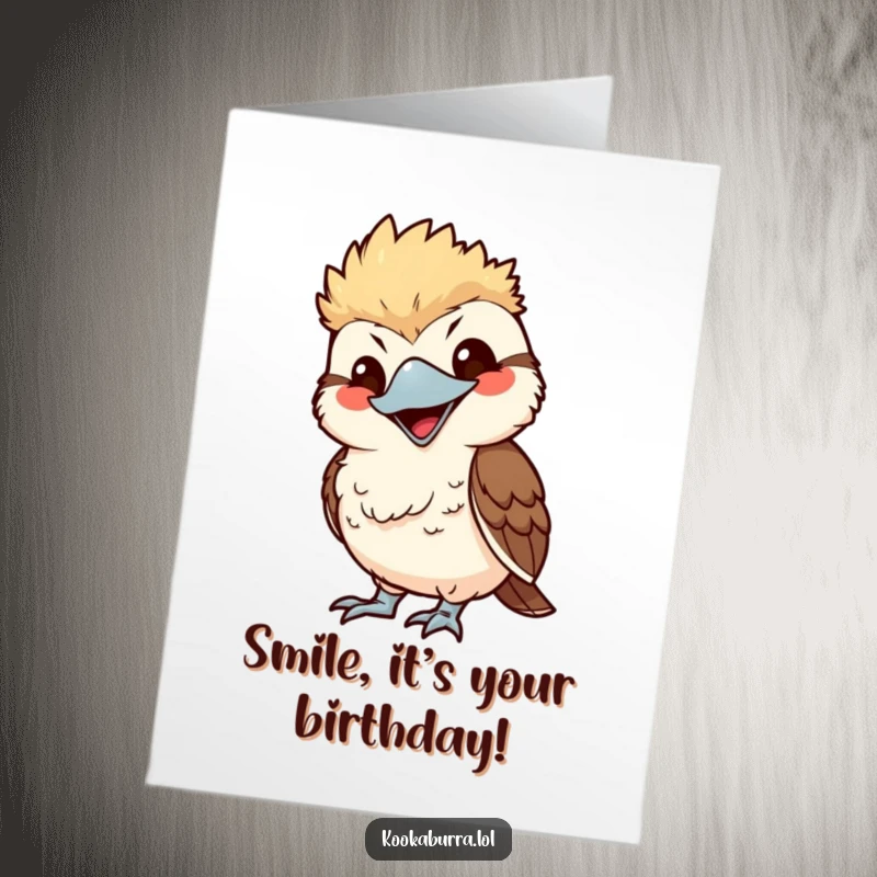 Funny Free Printable Birthday Card of a kawaii kookaburra playfully mimicking someone with an exaggerated, cheeky smile.