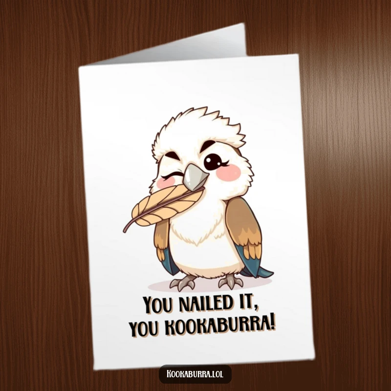 Funny Free Printable Congratulations Card: Kawaii kookaburra winking with a feather on its beak, celebrating success with a smile.