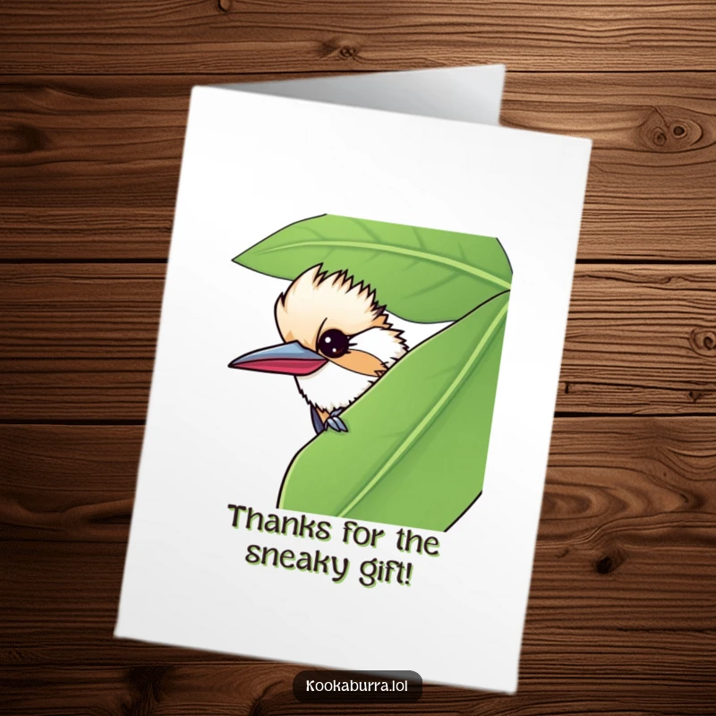 Funny Free Printable Thank You Card: A kookaburra winks slyly from behind a leaf, expressing thanks playfully. Humorous downloadable gift.