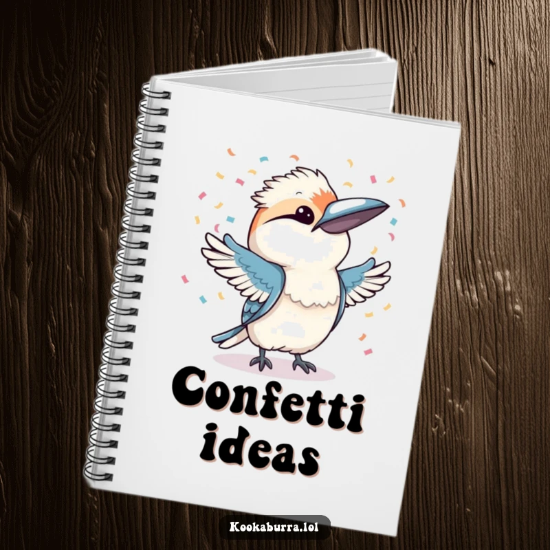 Funny kookaburra joyfully throwing confetti with both wings, printed on a notebook cover, inspiring festive creativity.