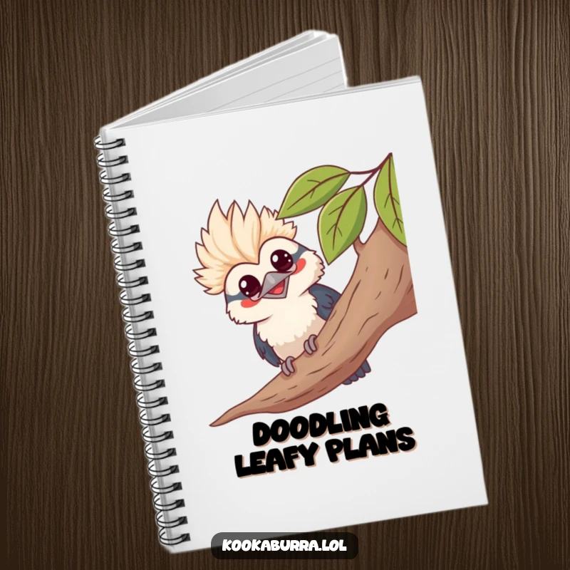 Funny kawaii kookaburra notebook, peeking from leaves, grinning, cute bird illustration, ideal for journaling.