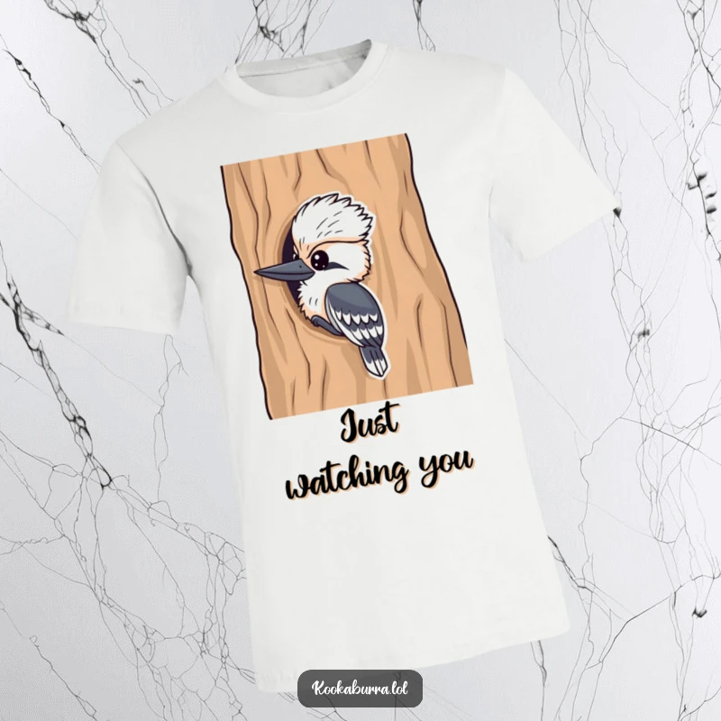 Funny kookaburra t-shirt, a curious bird peeking from a tree trunk, conveying playful mischief and joy.