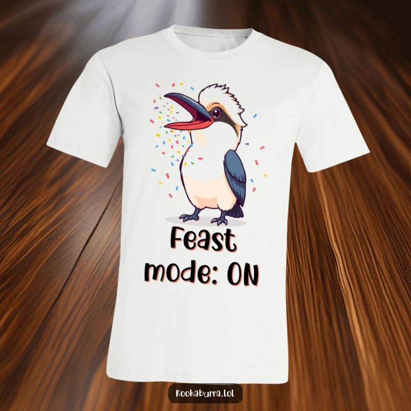 Funny Kookaburra T-Shirt of a kookaburra with its beak wide open, showering colorful confetti, perfect for festive occasions.