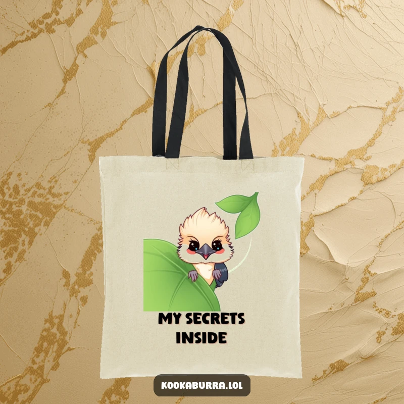 Funny Kawaii Kookaburra tote bag, a cute bird peeking from behind a leaf, full of playful curiosity. Ideal for errands and funny gifts.