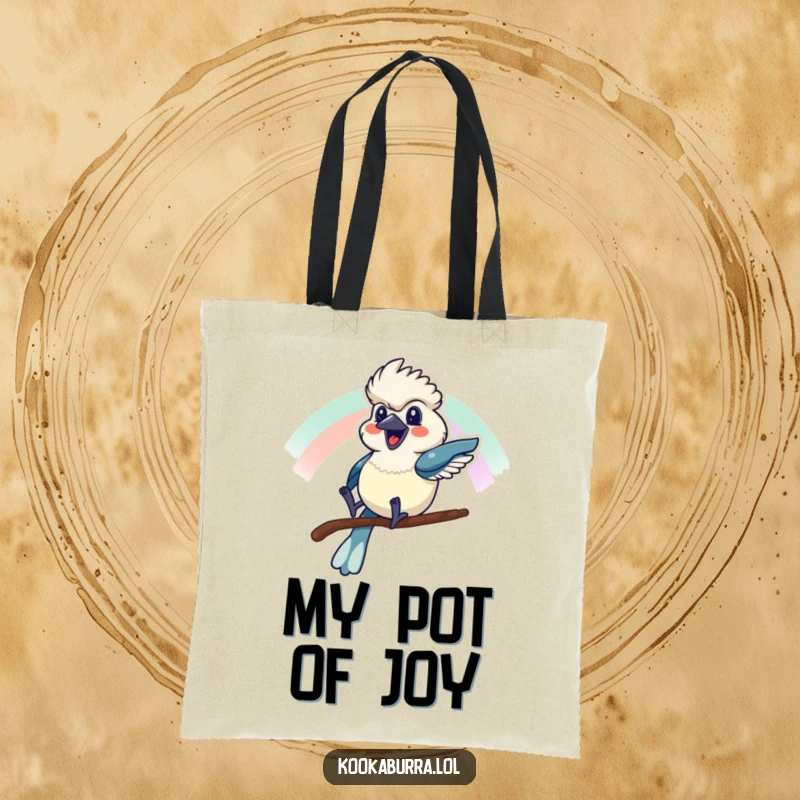 Funny tote bag with a kookaburra sliding down a rainbow with a cheerful grin, perfect for joyful errands.